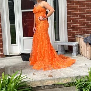 orange and size 8 long and we added a bustle on the back so you can pin it up.
